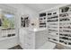 Custom walk-in closet with ample shoe storage and natural light at 1711 Indigo Island Dr, Hanahan, SC 29410