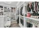 Bright walk-in closet with custom shelving for shoes, bags, and clothing at 1711 Indigo Island Dr, Hanahan, SC 29410