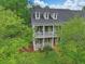 Aerial view of two story home with double porches, dormer windows, and well-maintained landscaping at 1787 Tennyson Row # 9, Mount Pleasant, SC 29466