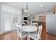 Bright dining area featuring a white table, white chairs, and access to a large patio area at 1787 Tennyson Row # 9, Mount Pleasant, SC 29466