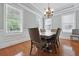 Elegant dining room featuring hardwood floors, a chandelier, and abundant natural light at 1787 Tennyson Row # 9, Mount Pleasant, SC 29466
