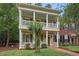 Charming two-story home featuring a double porch with white columns and shutters at 1787 Tennyson Row # 9, Mount Pleasant, SC 29466