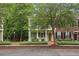 Beautiful two-story home with double porches, inviting entrance, and lush green trees at 1787 Tennyson Row # 9, Mount Pleasant, SC 29466