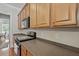 Kitchen with stainless steel appliances, wood cabinets, and solid surface countertops at 1787 Tennyson Row # 9, Mount Pleasant, SC 29466