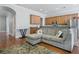 Cozy living area connected to a well-equipped kitchen, featuring hardwood floors and natural light at 1787 Tennyson Row # 9, Mount Pleasant, SC 29466