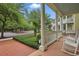 Inviting front porch with white rocking chairs and serene views of the neighborhood at 1787 Tennyson Row # 9, Mount Pleasant, SC 29466