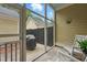 Inviting screened porch with grill, rocking chairs, and view of fenced backyard at 1787 Tennyson Row # 9, Mount Pleasant, SC 29466