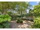 A beautiful backyard with brick-lined stone pavers and lush greenery at 19 Ashley Ave, Charleston, SC 29401