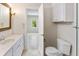 Bathroom with tile floor, white vanity with light countertop, and doorway to bedroom at 19 Ashley Ave, Charleston, SC 29401