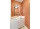 Half bathroom featuring an ornate mirror and decorative wallpaper at 19 Ashley Ave, Charleston, SC 29401