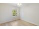 Bedroom featuring hardwood floors, white walls and trim, crown molding, and a large window at 19 Ashley Ave, Charleston, SC 29401