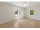 Bright bedroom featuring hardwood floors, and two windows that provide lots of natural light at 19 Ashley Ave, Charleston, SC 29401