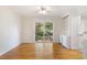 Bright dining area with wood floors, white built-ins, and a sliding door to the outdoor space at 19 Ashley Ave, Charleston, SC 29401