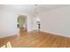 Dining room with hardwood floors with views into kitchen and outdoor spaces at 19 Ashley Ave, Charleston, SC 29401
