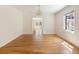 Inviting dining room with hardwood floors and a stylish chandelier, ideal for hosting gatherings at 19 Ashley Ave, Charleston, SC 29401