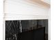 Close-up of a fireplace with marble surround, showcasing its elegant design at 19 Ashley Ave, Charleston, SC 29401