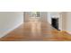 Bright and airy living room with hardwood floors and a cozy fireplace, offering a comfortable living space at 19 Ashley Ave, Charleston, SC 29401