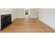 Spacious living room with hardwood floors and a fireplace, perfect for relaxation and entertaining at 19 Ashley Ave, Charleston, SC 29401