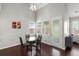 Breakfast nook with glass table, four chairs, and multiple windows providing natural light at 203 Yeamans Way, Summerville, SC 29483