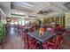 Bright and spacious dining area with tables, chairs, a bar, and natural light at 203 Yeamans Way, Summerville, SC 29483