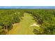 Scenic view of the golf course with manicured green grass, mature trees, and sand traps at 203 Yeamans Way, Summerville, SC 29483