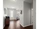 Bright hallway featuring wood floors, neutral walls, and a view into the adjacent living area at 203 Yeamans Way, Summerville, SC 29483