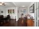 Inviting hallway with dark wood floors, elegant decor, and a view leading to the staircase at 203 Yeamans Way, Summerville, SC 29483