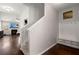 Hallway with a coat rack station, wood floors, and an open view into the cozy living room at 203 Yeamans Way, Summerville, SC 29483