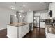 Spacious kitchen with a central island sink, stainless steel appliances, and white cabinetry at 203 Yeamans Way, Summerville, SC 29483