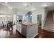 Modern kitchen with stainless steel appliances, granite countertops and an island with bar seating at 203 Yeamans Way, Summerville, SC 29483