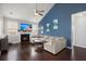Living room with fireplace, large TV, comfortable sectional sofa, and high ceilings at 203 Yeamans Way, Summerville, SC 29483