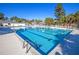 Outdoor pool with lounge chairs surrounded by mature trees, perfect for enjoying the summer sun at 203 Yeamans Way, Summerville, SC 29483