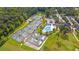 Aerial view of multiple tennis courts with a clubhouse and swimming pool, surrounded by trees and landscaping at 203 Yeamans Way, Summerville, SC 29483