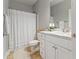 Bathroom featuring a vanity with marble countertop, toilet, shower and tile floor at 204 Read St, Moncks Corner, SC 29461