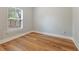 This vacant bedroom features natural light and wood floors at 204 Read St, Moncks Corner, SC 29461