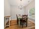 Inviting dining room with rustic table, chandelier lighting and natural light at 204 Read St, Moncks Corner, SC 29461