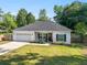 Charming single-story home with a well-manicured lawn, white exterior, and inviting front porch at 204 Read St, Moncks Corner, SC 29461
