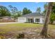Attractive single-story home with a well-kept front yard, a long driveway, and inviting entryway with black shutters at 204 Read St, Moncks Corner, SC 29461
