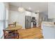 Bright kitchen with a round dining table, stainless steel appliances, and white cabinets offering a clean, modern look at 204 Read St, Moncks Corner, SC 29461