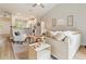 Open concept living room with light-colored walls, wood floors, modern furniture, and views of the kitchen at 204 Read St, Moncks Corner, SC 29461