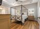 Spacious main bedroom featuring a four-poster bed, tray ceiling and ceiling fan at 204 Read St, Moncks Corner, SC 29461