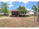 Backyard featuring a screened porch, a privacy fence, and mature shade trees at 209 Lipman St, Summerville, SC 29483