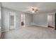 Large bedroom with neutral carpet, paint, and trim has plenty of room and natural light at 209 Lipman St, Summerville, SC 29483