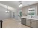 Dining area and kitchen featuring stainless appliances, stone backsplash, sleek countertops, and stylish cabinetry at 209 Lipman St, Summerville, SC 29483