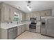 Well-equipped kitchen featuring stainless steel appliances, modern countertops, and stylish cabinetry offers functionality and elegance at 209 Lipman St, Summerville, SC 29483