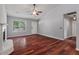 Bright living room boasts a cozy fireplace, gleaming hardwood floors, and neutral paint at 209 Lipman St, Summerville, SC 29483