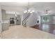 Open-concept living room showcases a fireplace, hardwood floors, and easy access to a modern kitchen with stainless appliances at 209 Lipman St, Summerville, SC 29483