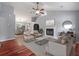 Bright living room with fireplace, hardwood floors, neutral decor, and an open layout at 209 Lipman St, Summerville, SC 29483