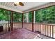 View of a lovely screened porch with wood floors and view of the wooded backyard at 209 Lipman St, Summerville, SC 29483