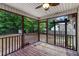 View of a lovely screened porch with wood floors and view of the wooded backyard at 209 Lipman St, Summerville, SC 29483